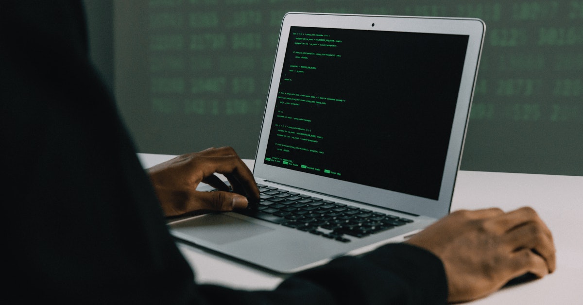 person typing on laptop